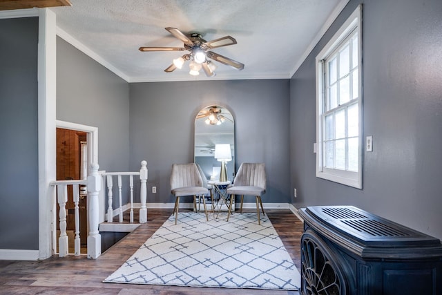 1529 W Grab Creek Rd, Dickson, TN 37055 - living area featuring ceiling fan, dark wood-style flooring, ornamental molding, baseboards, and an upstairs landing