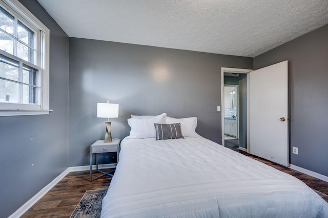 1529 W Grab Creek Rd, Dickson, TN 37055 - bedroom featuring baseboards, wood finished floors, and a textured ceiling