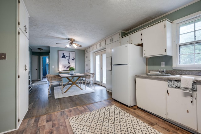 1529 W Grab Creek Rd, Dickson, TN 37055 - kitchen featuring freestanding refrigerator, white cabinets, a textured ceiling, dark wood-style floors, and ceiling fan
