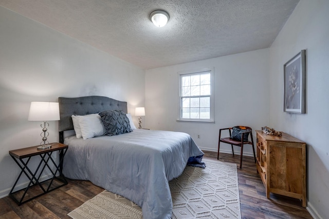 1529 W Grab Creek Rd, Dickson, TN 37055 - bedroom featuring a textured ceiling, wood finished floors, and baseboards