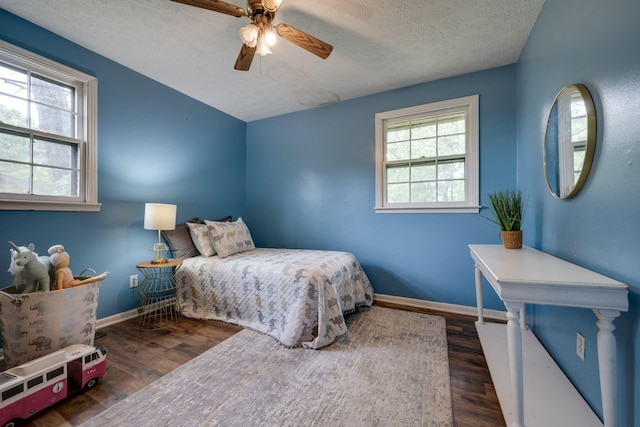 1529 W Grab Creek Rd, Dickson, TN 37055 - bedroom featuring a textured ceiling, wood finished floors, baseboards, and a ceiling fan