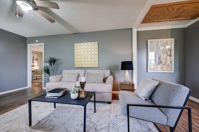 1529 W Grab Creek Rd, Dickson, TN 37055 - living area with wood finished floors, a ceiling fan, baseboards, and a textured ceiling