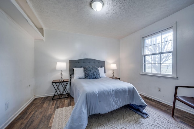 1529 W Grab Creek Rd, Dickson, TN 37055 - bedroom featuring wood finished floors, a textured ceiling, and baseboards