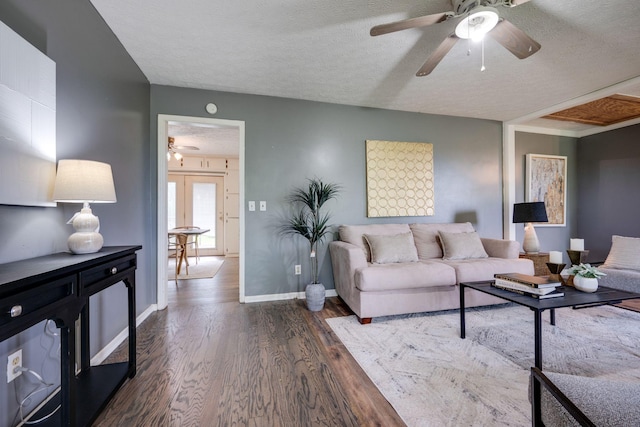 1529 W Grab Creek Rd, Dickson, TN 37055 - living area with a ceiling fan, dark wood-style flooring, a textured ceiling, and baseboards