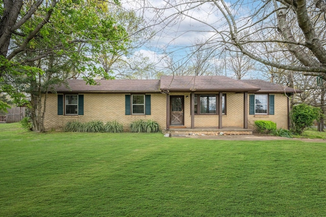 1529 W Grab Creek Rd, Dickson, TN 37055 - ranch-style house featuring brick siding, a front yard, and covered porch