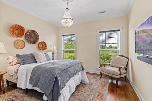 4145 Trinity Rd, Franklin, TN 37067 - bedroom featuring wood finished floors, a chandelier, crown molding, and baseboards