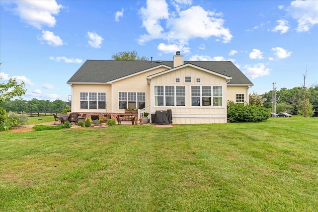 4145 Trinity Rd, Franklin, TN 37067 - rear view of house featuring board and batten siding, a chimney, a lawn, and roof with shingles