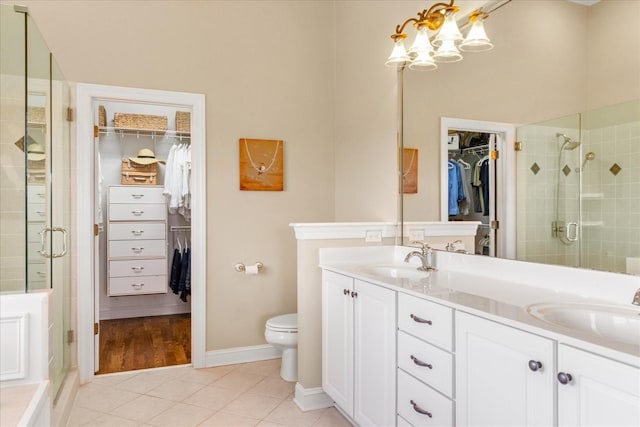 4145 Trinity Rd, Franklin, TN 37067 - full bath with tile patterned floors, double vanity, a stall shower, and a spacious closet