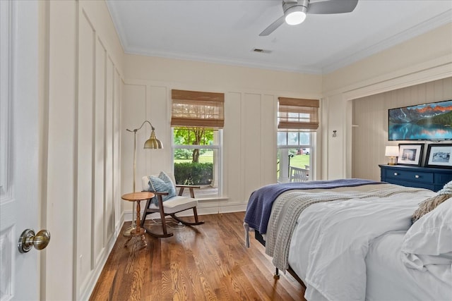 4145 Trinity Rd, Franklin, TN 37067 - bedroom with wood finished floors, crown molding, a decorative wall, and a ceiling fan