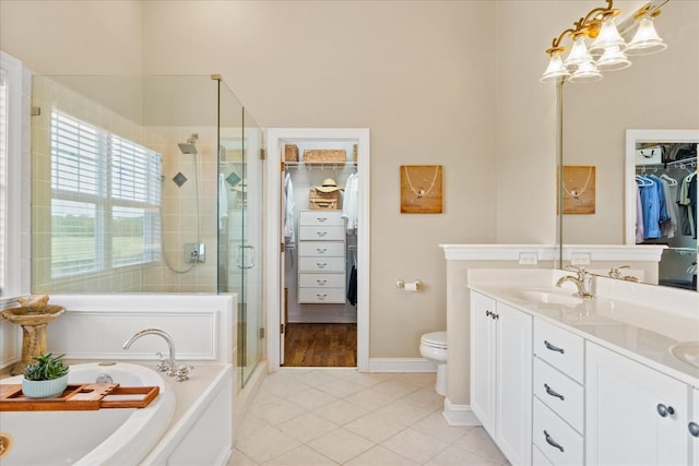 4145 Trinity Rd, Franklin, TN 37067 - bathroom with a shower stall, a bath, double vanity, tile patterned flooring, and a spacious closet