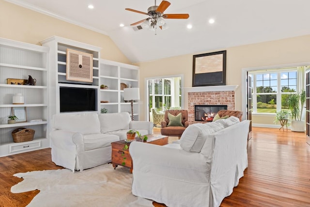 4145 Trinity Rd, Franklin, TN 37067 - living area featuring a brick fireplace, wood finished floors, a ceiling fan, recessed lighting, and vaulted ceiling