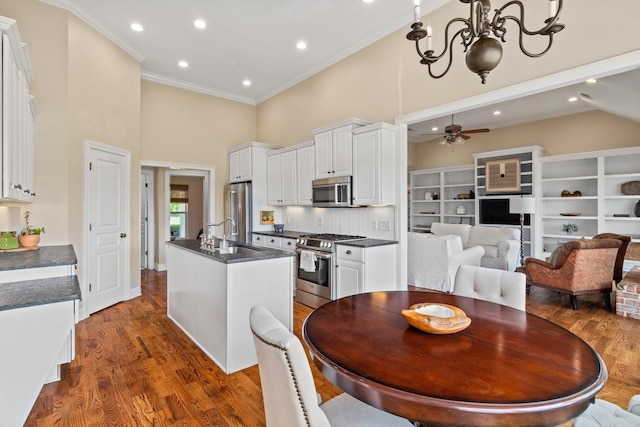 4145 Trinity Rd, Franklin, TN 37067 - dining room featuring a high ceiling, ceiling fan, dark wood-style floors, recessed lighting, and ornamental molding