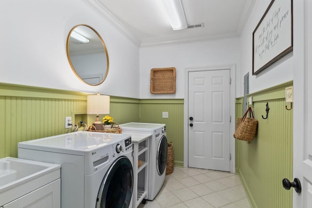 4145 Trinity Rd, Franklin, TN 37067 - laundry room with independent washer and dryer, crown molding, light tile patterned floors, and a wainscoted wall