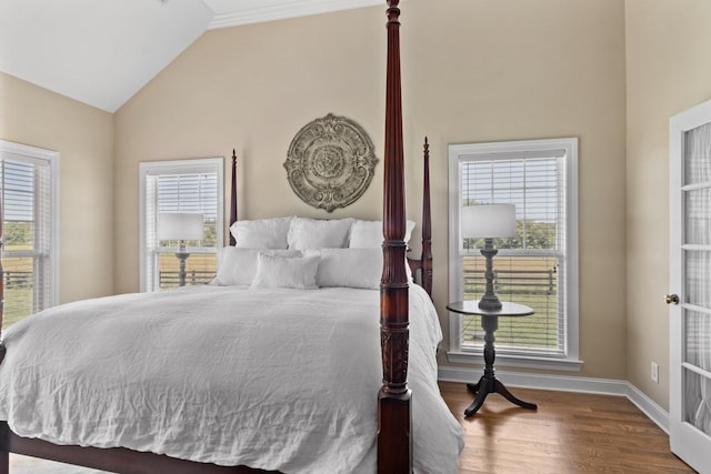 4145 Trinity Rd, Franklin, TN 37067 - bedroom featuring multiple windows, lofted ceiling, wood finished floors, and baseboards