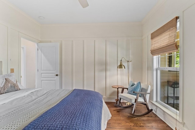 4145 Trinity Rd, Franklin, TN 37067 - bedroom featuring crown molding, wood finished floors, a decorative wall, and ceiling fan