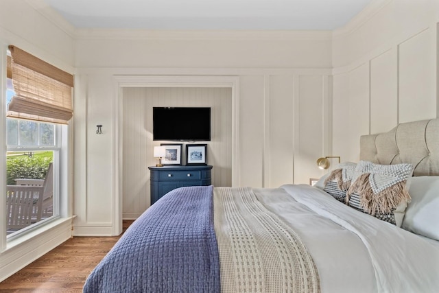 4145 Trinity Rd, Franklin, TN 37067 - bedroom featuring a decorative wall, wood finished floors, and crown molding