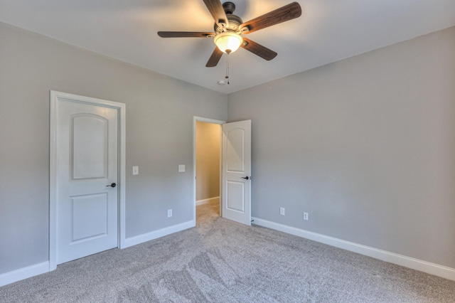 1021 Hideaway Rd, Columbia, TN 38401 - unfurnished bedroom featuring light colored carpet, baseboards, and a ceiling fan