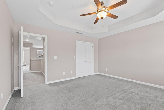 215 Ruth Way, Spring Hill, TN 37174 - unfurnished bedroom with carpet, attic access, a tray ceiling, and baseboards