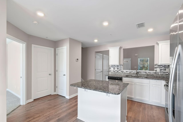 215 Ruth Way, Spring Hill, TN 37174 - kitchen with a sink, backsplash, dishwashing machine, white cabinetry, and recessed lighting