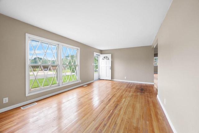 209 Orchard Rd, Clarksville, TN 37042 - unfurnished living room featuring plenty of natural light, light wood finished floors, and baseboards