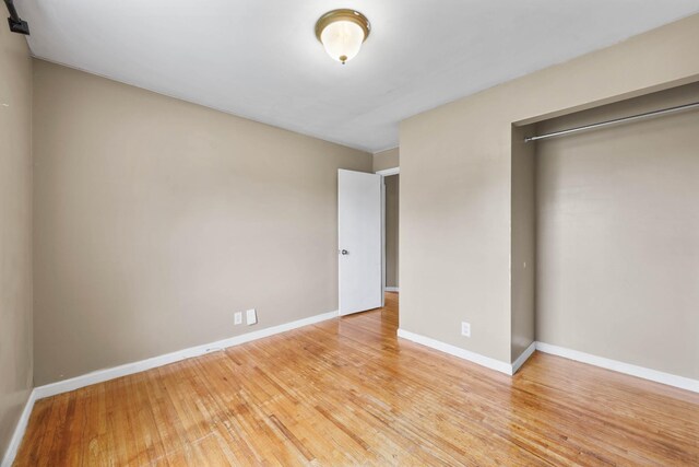 209 Orchard Rd, Clarksville, TN 37042 - unfurnished bedroom with light wood finished floors, baseboards, and a closet