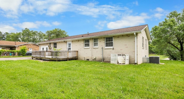 209 Orchard Rd, Clarksville, TN 37042 - back of property with brick siding, a deck, a yard, and central AC