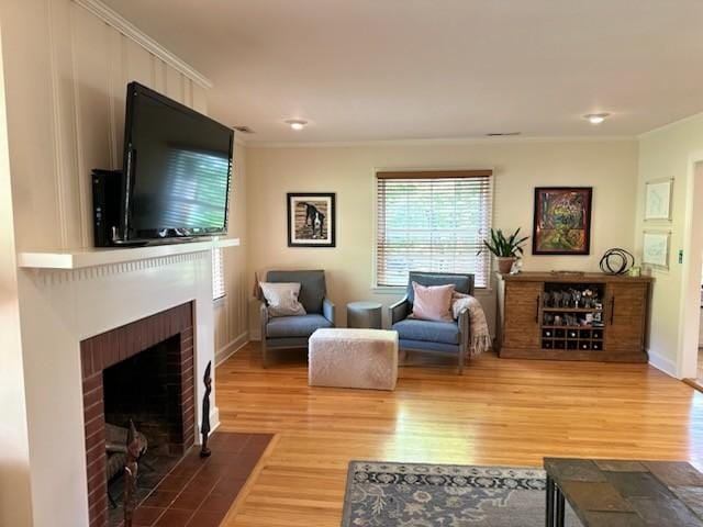 108 Sunset Dr, Pulaski, TN 38478 - living area with a fireplace, wood finished floors, crown molding, and baseboards