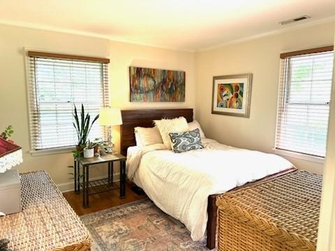 108 Sunset Dr, Pulaski, TN 38478 - bedroom with multiple windows and wood finished floors