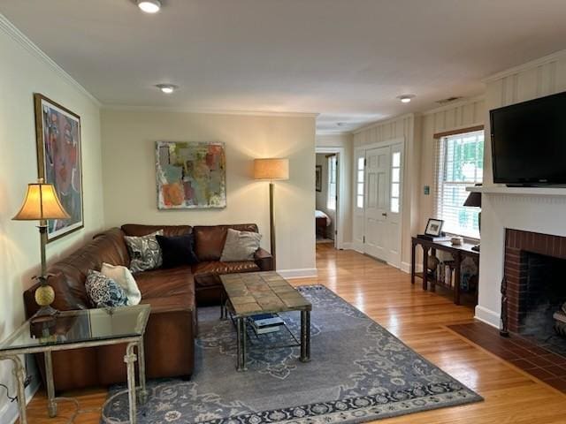 108 Sunset Dr, Pulaski, TN 38478 - living room with ornamental molding, wood finished floors, a fireplace, and baseboards