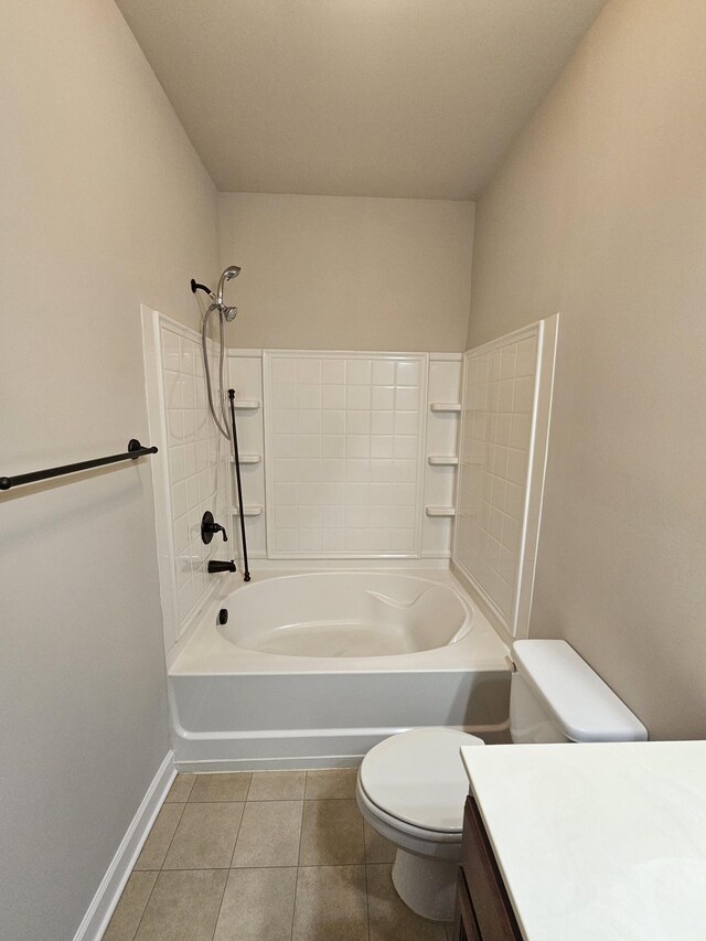 1040 Charlie Daniels Pkwy Unit 111, Mount Juliet, TN 37122 - bathroom featuring toilet, tile patterned flooring, baseboards, vanity, and washtub / shower combination