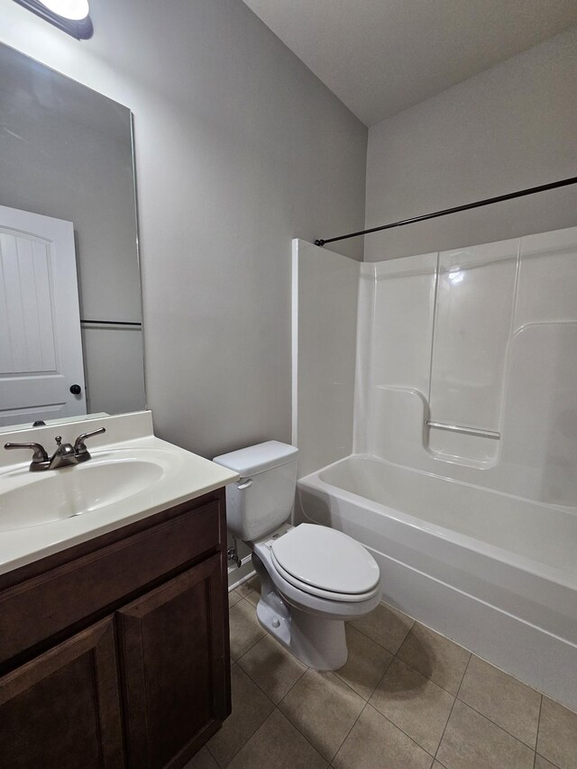1040 Charlie Daniels Pkwy Unit 111, Mount Juliet, TN 37122 - bathroom with toilet, vanity, tile patterned floors, and shower / bathtub combination