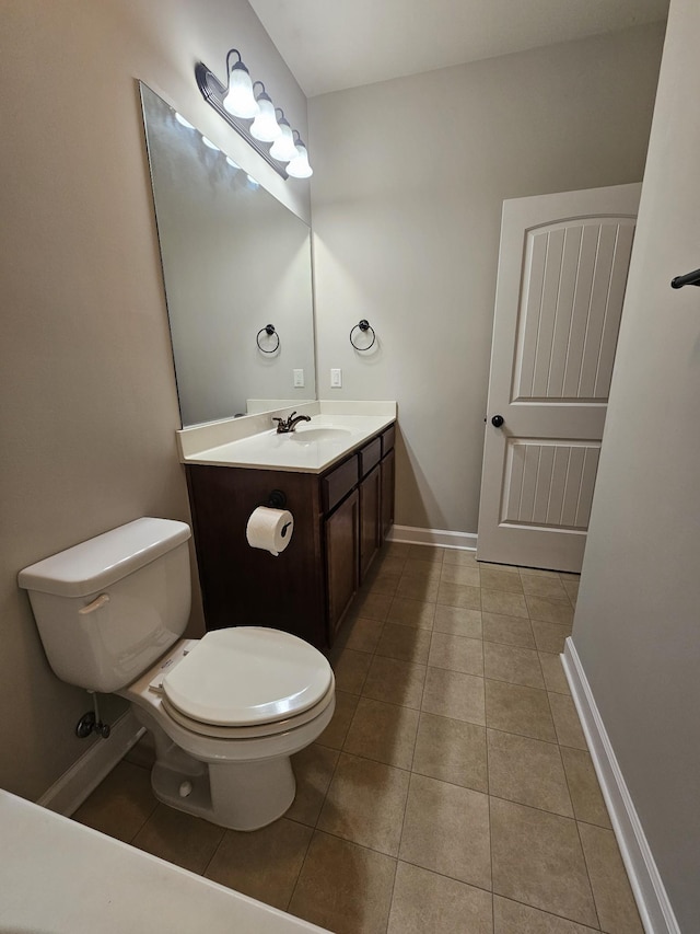 1040 Charlie Daniels Pkwy Unit 111, Mount Juliet, TN 37122 - half bathroom with tile patterned flooring, baseboards, toilet, and vanity