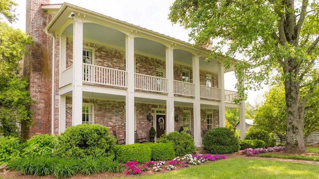 5620 Leipers Creek Rd, Franklin, TN 37064 - rear view of property featuring a balcony, covered porch, a chimney, and brick siding