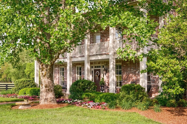 5620 Leipers Creek Rd, Franklin, TN 37064 - view of front facade with a balcony and brick siding