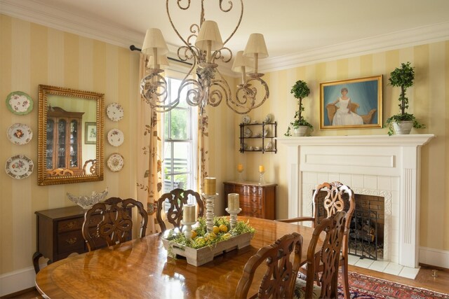 5620 Leipers Creek Rd, Franklin, TN 37064 - dining space with crown molding, a chandelier, wallpapered walls, wood finished floors, and baseboards