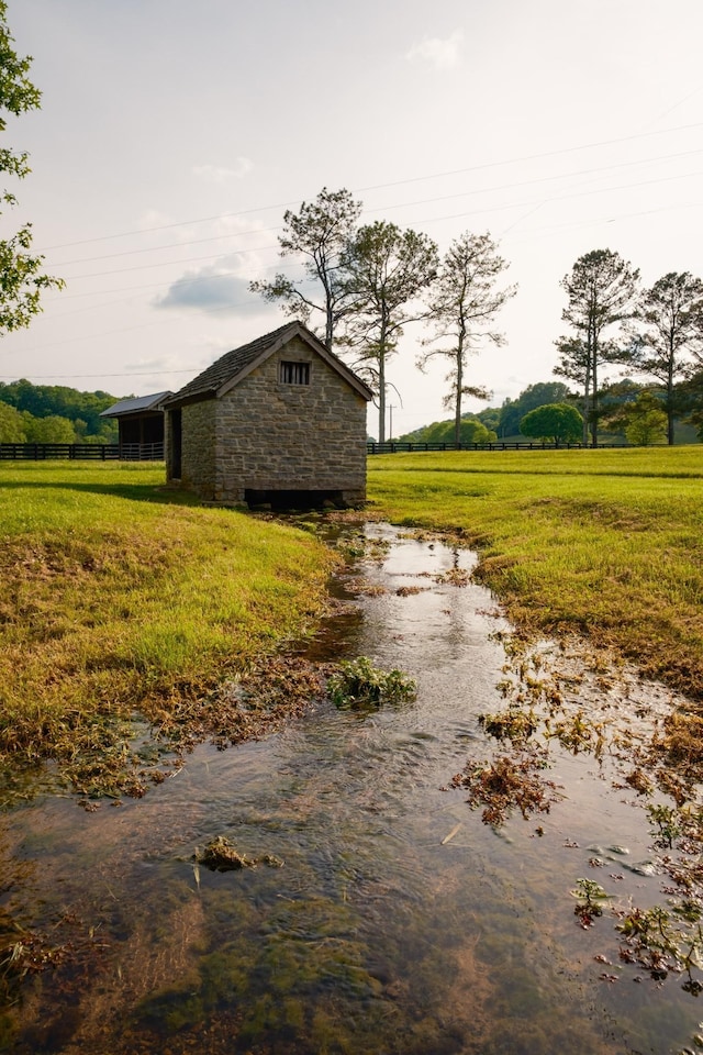 5620 Leipers Creek Rd, Franklin, TN 37064 - view of side of property with stone siding and fence