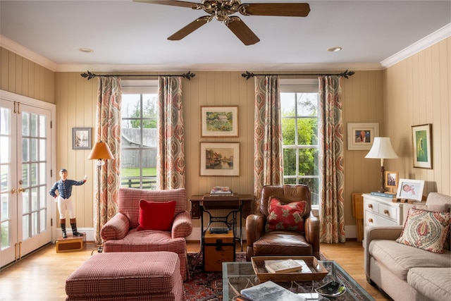 5620 Leipers Creek Rd, Franklin, TN 37064 - living room with crown molding, wood finished floors, a ceiling fan, french doors, and wooden walls