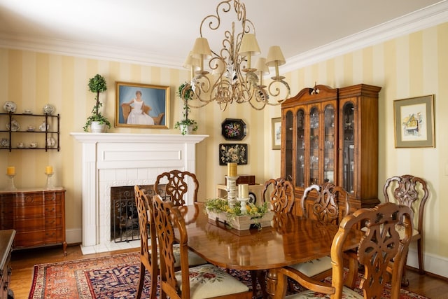 5620 Leipers Creek Rd, Franklin, TN 37064 - dining area with a chandelier, wallpapered walls, crown molding, wood finished floors, and baseboards
