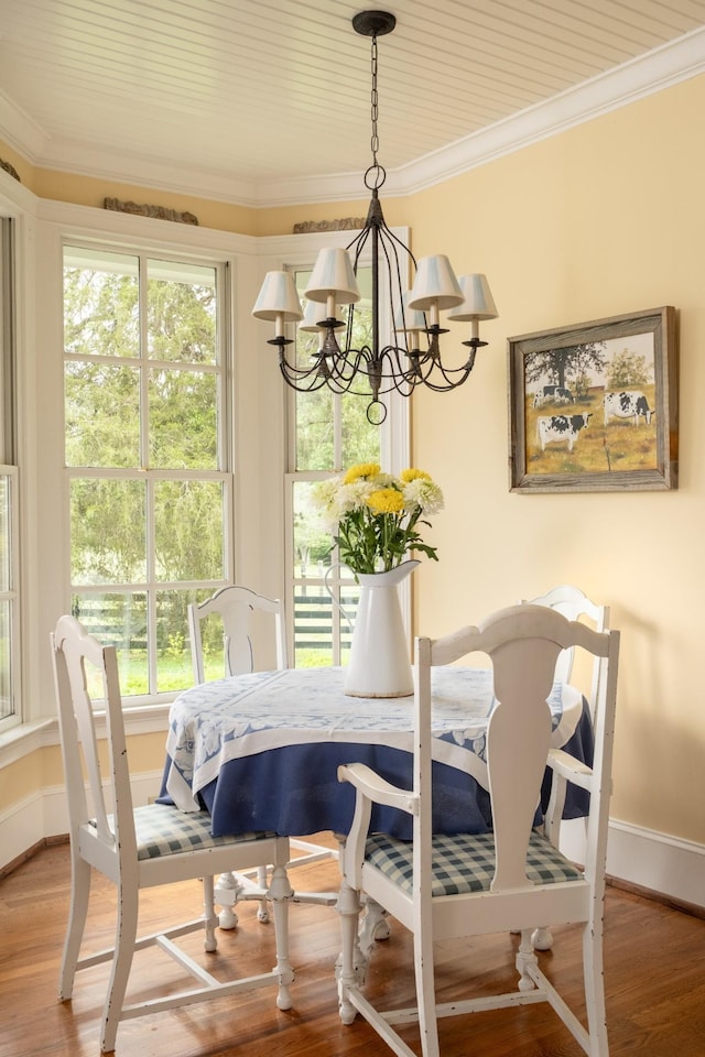 5620 Leipers Creek Rd, Franklin, TN 37064 - dining room featuring crown molding, a chandelier, baseboards, healthy amount of natural light, and wood finished floors