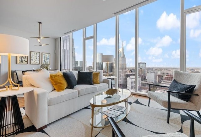 160 2nd Ave S Unit 2205, Nashville, TN 37201 - living area with a wall of windows, a skyline view, wood finished floors, and ceiling fan