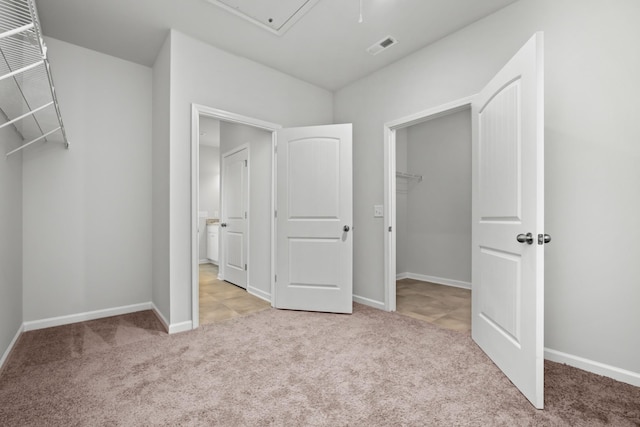 217 Summerlin Dr, Gallatin, TN 37066 - unfurnished bedroom featuring carpet floors, a walk in closet, attic access, baseboards, and a closet