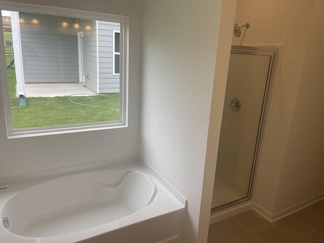 217 Summerlin Dr, Gallatin, TN 37066 - bathroom featuring healthy amount of natural light, a shower stall, a garden tub, and tile patterned flooring