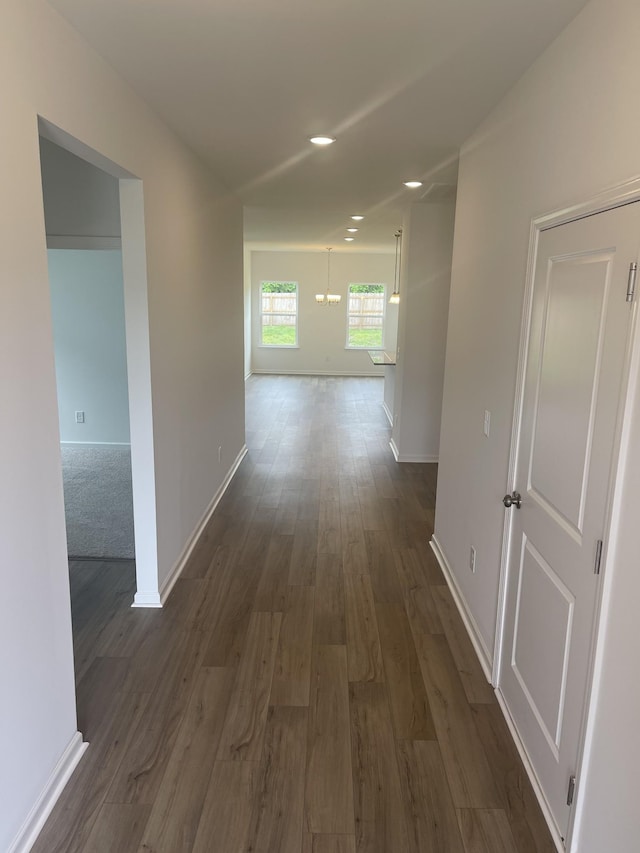 217 Summerlin Dr, Gallatin, TN 37066 - hall with a chandelier, dark wood-type flooring, baseboards, and recessed lighting