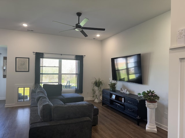 living area with a ceiling fan, dark wood finished floors, baseboards, and recessed lighting
