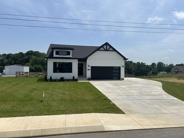 modern farmhouse style home with a front lawn, concrete driveway, and an attached garage
