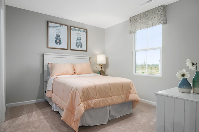carpeted bedroom featuring baseboards