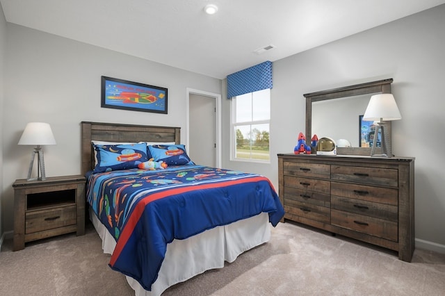 bedroom with carpet flooring and baseboards