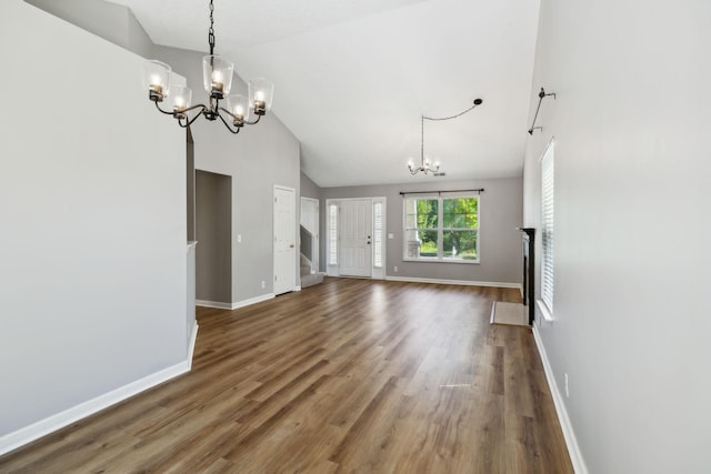 2981 Buckner Ln, Spring Hill, TN 37174 - unfurnished living room featuring a chandelier, wood finished floors, baseboards, and high vaulted ceiling