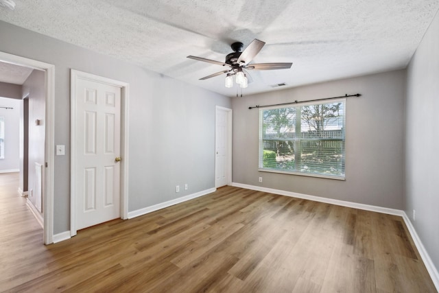 2981 Buckner Ln, Spring Hill, TN 37174 - unfurnished room featuring wood finished floors, ceiling fan, baseboards, and a textured ceiling
