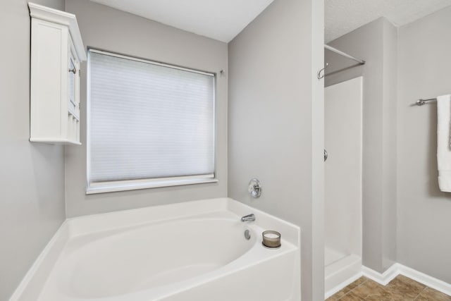2981 Buckner Ln, Spring Hill, TN 37174 - bathroom with a garden tub, a shower stall, and tile patterned flooring